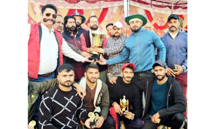 Chief Guest Narinder Singh Bhau presenting trophy to the winning team on Tuesday.