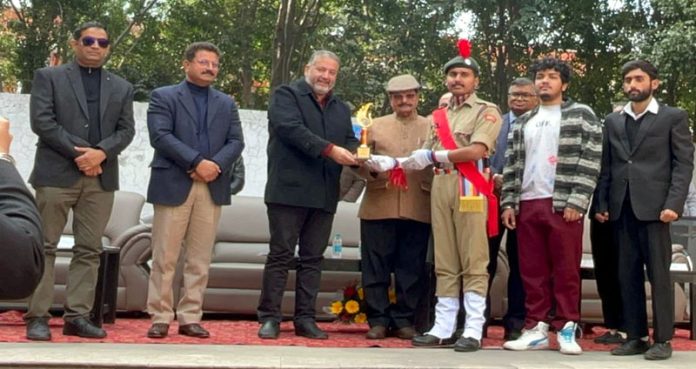 Dignitaries presenting certificates to outstanding college students during Annual Sports Meet.