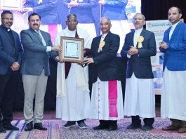 Fr Varkey TJ being honoured with Lifetime Achievement Award during a programme by DJSES.