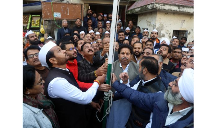 Cong leaders hoisting party flag during Foundation Day function at Jammu on Thursday.
