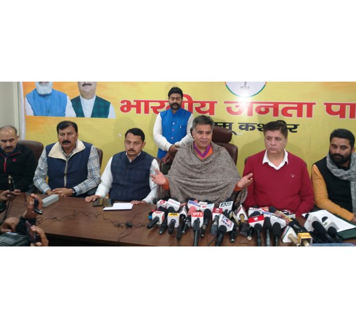 BJP president, Ravinder Raina, party chief spokesperson Sunil Sethi and other leaders at a press conference at Jammu on Monday.