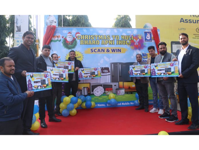 Eshu (Territory Manager, BPCL J&K and Ladakh) along with other officials launching lucky draw scheme at K N Filling Station, Bantalab (Jammu). -Excelsior/Rakesh