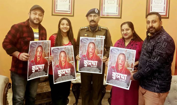 SSP Mohan Lal Bhagat releasing the poster of movie 'Kupratha' in Jammu on Friday.