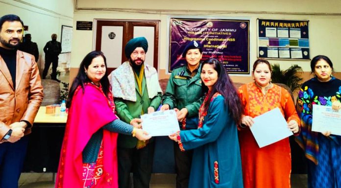 Prof. Jasbir Singh, Rector Kishtwar Campus, JU felicitating students during a function at University of Jammu on Wednesday.