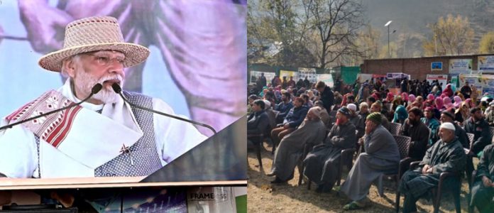 People listening video message of PM in Anantnag on Wednesday.