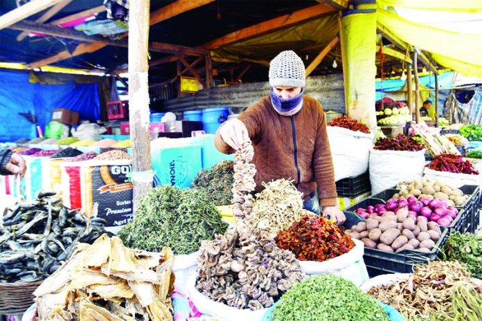 A shopkeeper sells dried vegetables in Srinagar that people consume during winters. —Excelsior/Shakeel