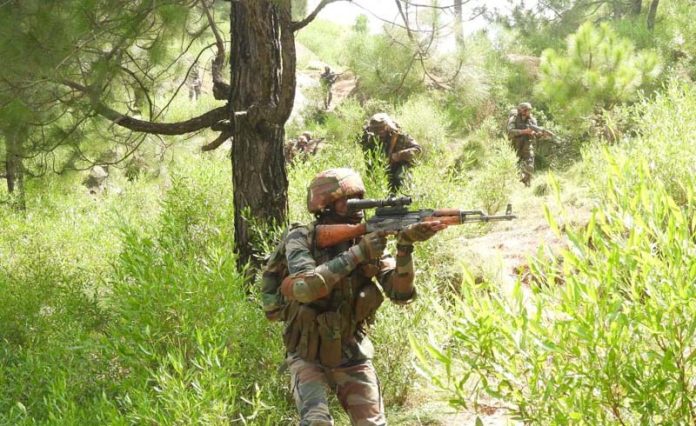 Security forces during search operation in a forest area of Kalakote on Monday. -Excelsior/Imran