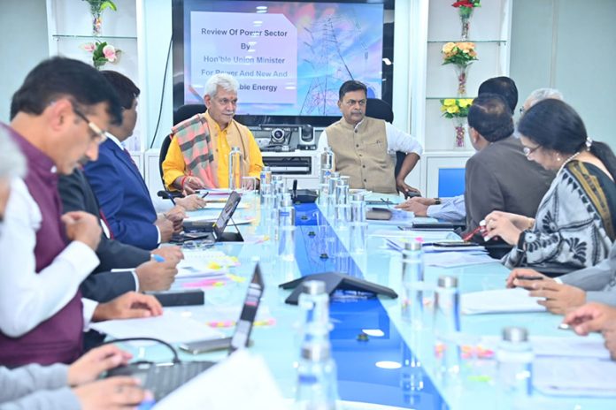 Power Minister R K Singh and LG Manoj Sinha chairing a meeting in New Delhi on Friday.