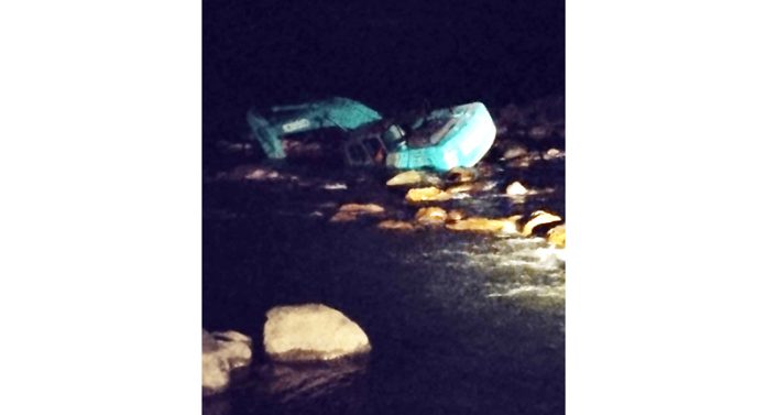 Submerged excavator in Ans river at Reasi.