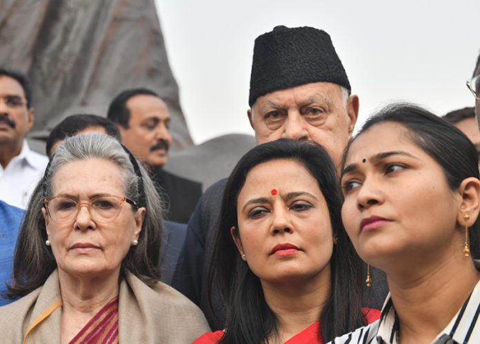 TMC leader Mahua Moitra with Congress leader Sonia Gandhi and others in front of the Gandhi statue after she was expelled from the Lok Sabha in New Delhi on Friday. (UNI)