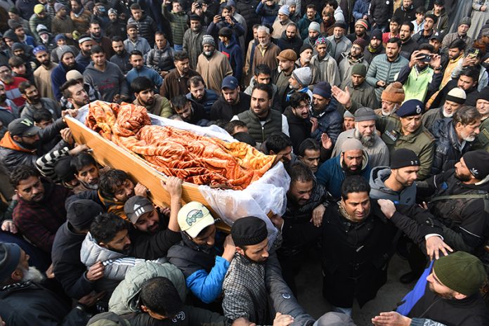 Large number of people join last rites of Inspector Masroor Ahmed Wani in Srinagar on Friday. — Excelsior/Shakeel