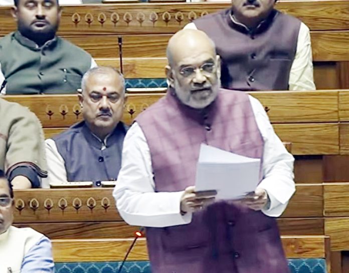 Union Home Minister Amit Shah speaks in the Lok Sabha on Wednesday.