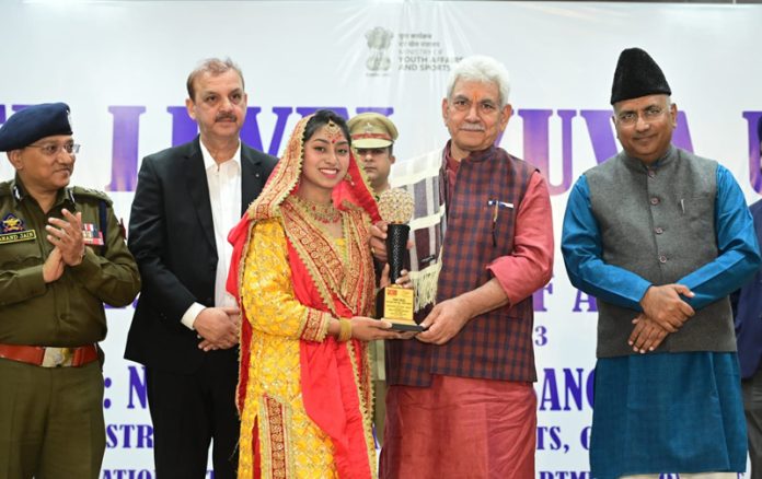 LG Manoj Sinha felicitating a girl at Yuva Utsav in Jammu.