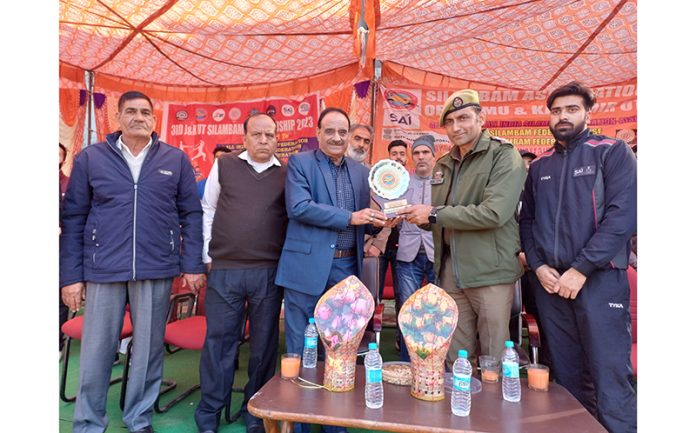 SHO Janipur, Virender Singh receiving memento from organisers.