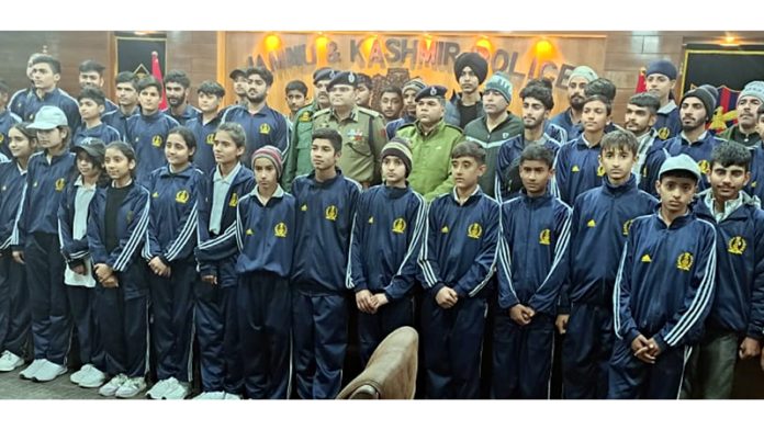 Senior police officers posing with students who participated in 24th Rashtra Katha Shivir at Rajkot on Monday.