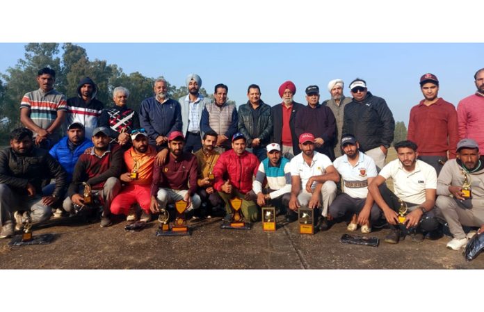 Dignitaries posing with winners of 4th Caddy Golf tournament at Jammu Tawi Golf Course on Monday.