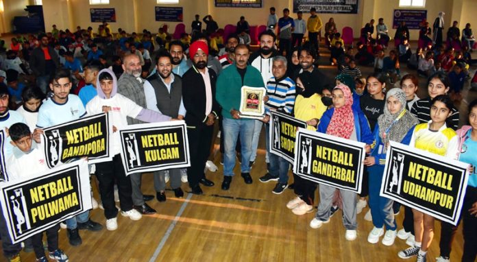 Chief guest Ranjeet Kalra, Member Jammu and Kashmir Sports Council posing with Netball teams of different districts at Jammu on Monday.
