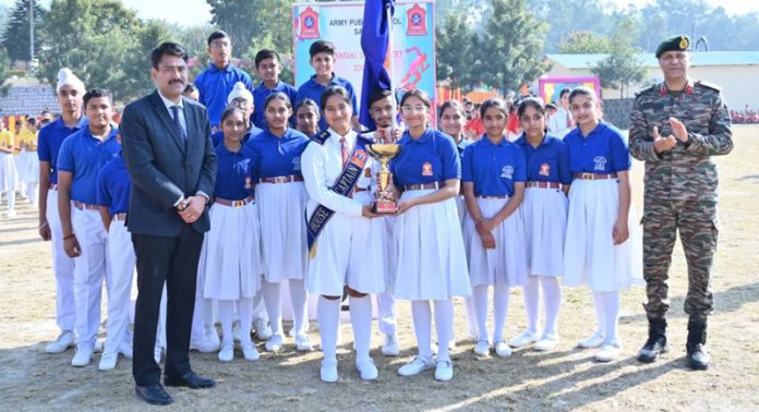 Students of Army Public School Samba along with dignitaries posing with chief guest during Annual Sports Day.