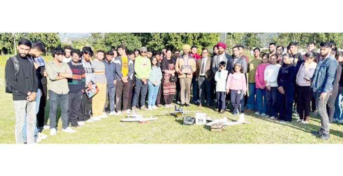 Participating students with flying handmade models of aircraft during practical session of workshop at SMVDU.