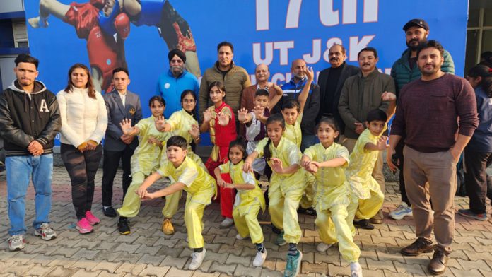 Budding Wushu players posing with dignitaries during championship at Jammu.