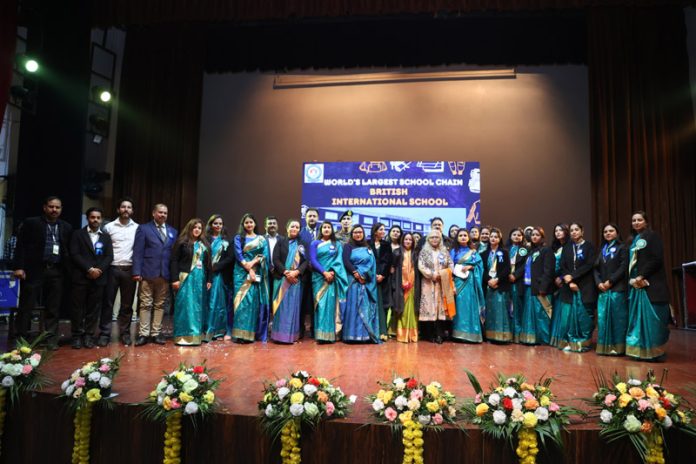 Dignitaries and School Management of British International School posing for group photograph during Annual Day event.