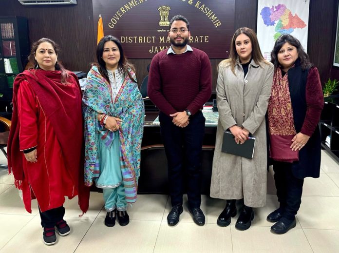 Members of a delegation of women posing for a photograph with Deputy Commissioner Jammu, Sachin Kumar Vaishya.