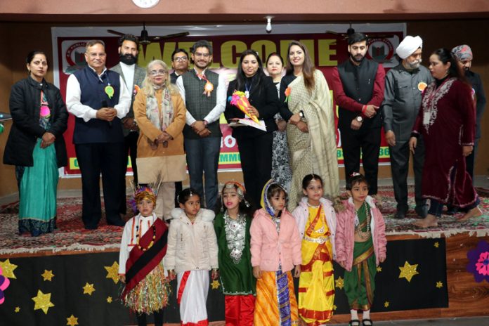 Dignitaries posing with students during an event at RM Public School.