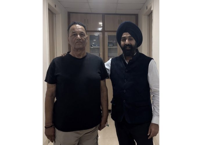 Ram Pal Sharma poses for a photograph with Dr. Ranjit after successful total knee replacement surgery.