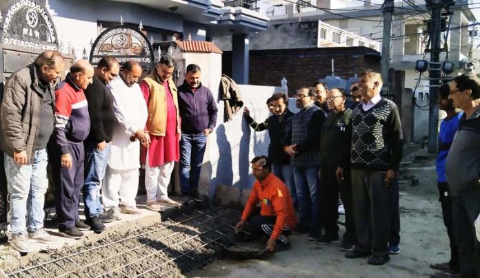 Former corporator and senior BJP leader, Sanjay Kumar Baru inspecting laying of tile work in Ward 41, Jammu on Tuesday.