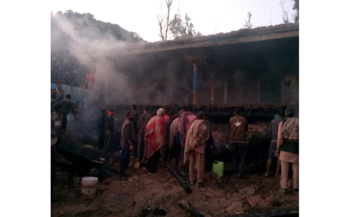 A house burning at Savad Village in Latti on Thursday.