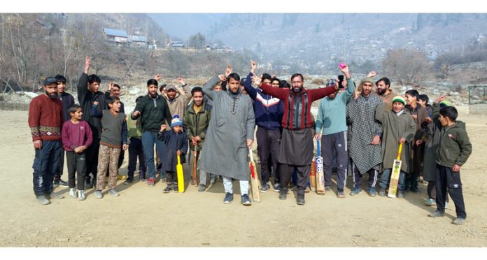 Residents of Chatergul in Central Kashmir’s Ganderbal district voicing discontent over the poorly constructed local playing field. —Excelsior/Firdous
