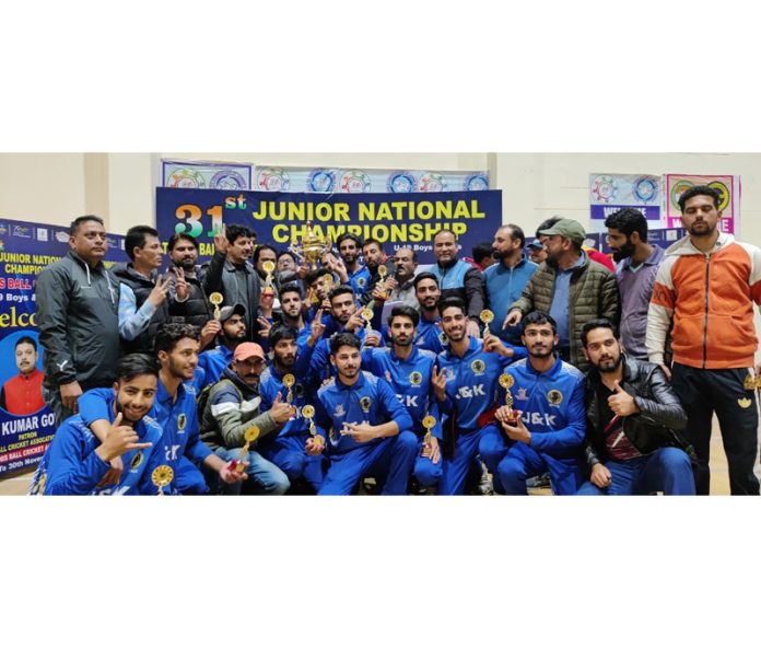 J&K Boys junior team posing with trophy.