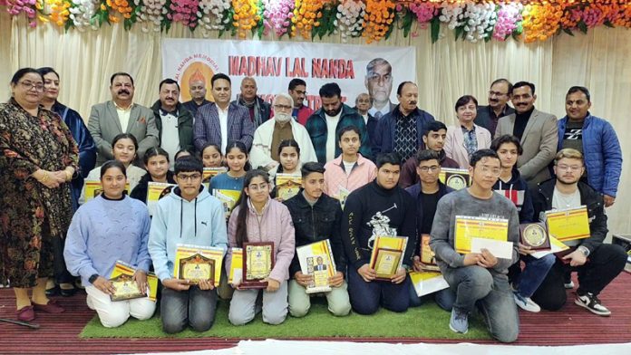 Meritorious students posing for gropup photograph alongwith dignitaries at Reasi on Thursday.