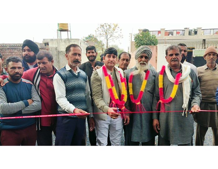 BJP leader, Surjit Chaudhary inaugurates construction work of a road at village Flora in R.S Pura.