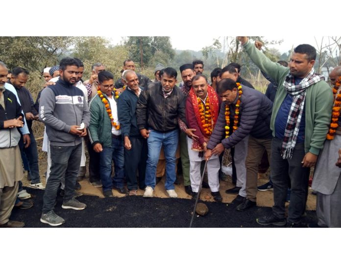 BJP leader, Vikram Randhawa starts road blacktopping work in Jammu on Sunday.