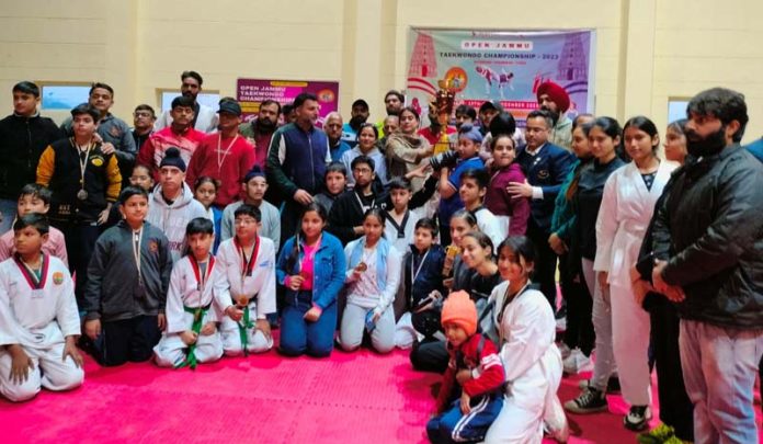 Nuzhat Gull, Secretary, J&K Sports Council presenting trophy to winners.