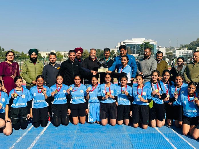 PG Department of Jammu University Kho-Kho women team posing with trophy. 