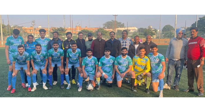 Football team posing with chief guest during 17th Christmas Gold Cup Football Tournament at Jammu.