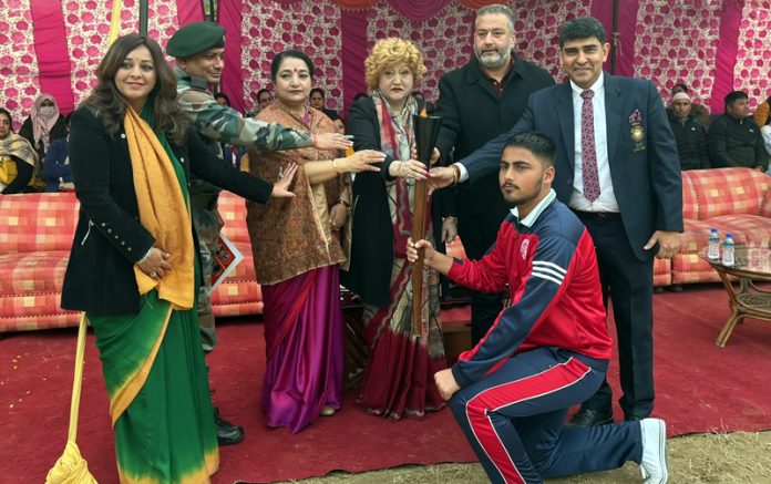 Sports captain of the School presenting torch to chief guest during Annual cum Sports Day function on Friday.