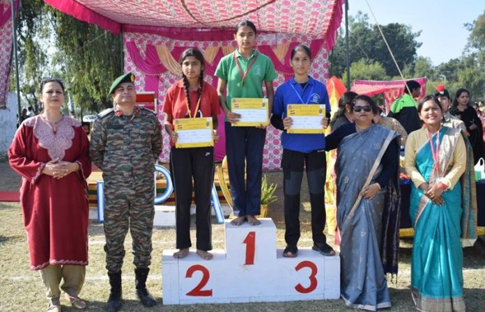 Winners posing with dignitaries during Annual Sports Day.