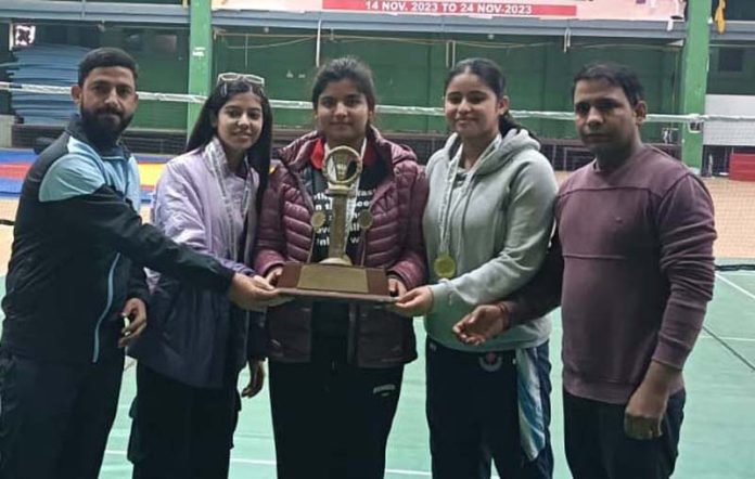 MIER Women’s Badminton team posing with trophy on Wednesday.