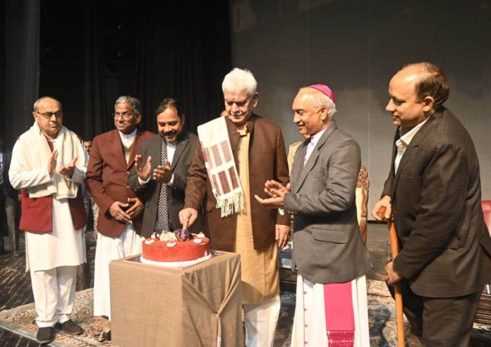 LG cutting Christmas cake at an event in Jammu.