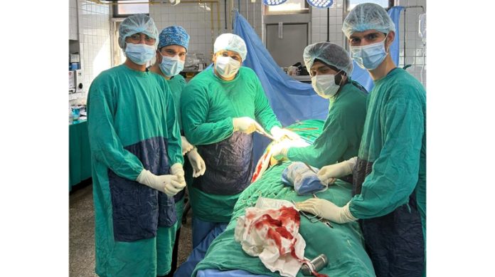 Dr Balvinder and his team performing Total Hip Replacement on a patient at GMC Udhampur.