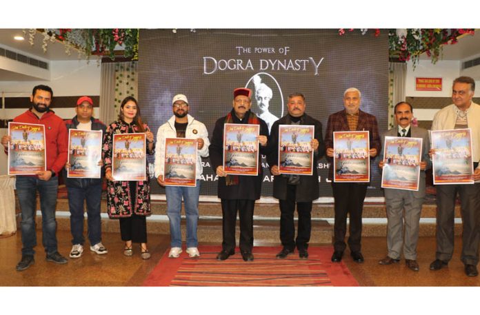 Devender Singh Rana, Sham Lal Sharma and Zorawar Singh along with others releasing Dogri album. -Excelsior/Rakesh