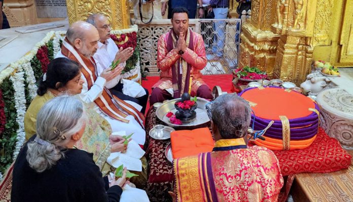 Union Home Minister Amit Shah offering prayer at Somnath Temple, in Somnath on Saturday. (UNI)