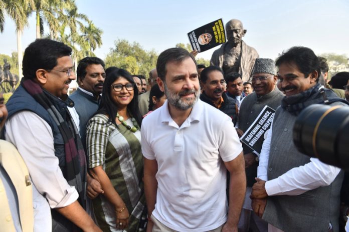 Congress President Mallikarjun Kharge, Party leader Rahul Gandhi join the portest of suspended MPs in front of Mahatma Gandhi statue at Parliament House, in New Delhi on Tuesday (UNI)