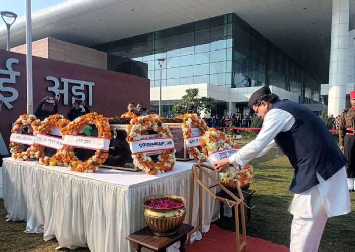 Uttarakhand Chief Minister Pushkar Singh Dhami paying last respects to the mortal remains of Rifleman Gautam Kumar of Kotdwar and Birendra Singh of Chamoli killed in a recent militant attack in Poonch, at Jollu Grand Airport, in Dehradun on Monday. (UNI)