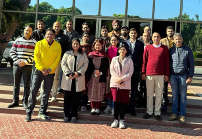 Participants posing for group photograph on concluding day of the training programme.