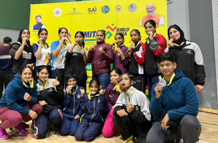 Jammu and Kashmir Women Wushu team posing with medals at Dehradun.