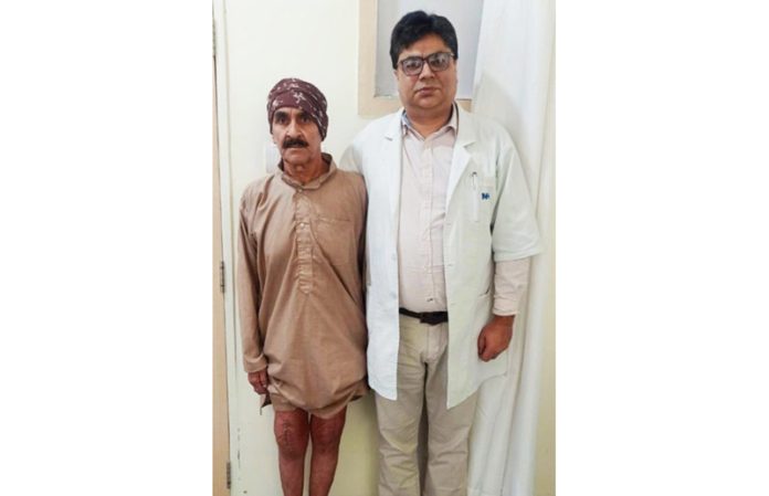 Dr Vikas Padha posing with a patient on whom he performed highly complex joint replacement surgery.